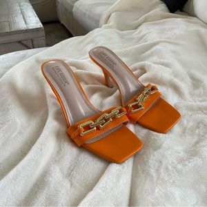 orange stiletto heels with gold buckle detail ✨